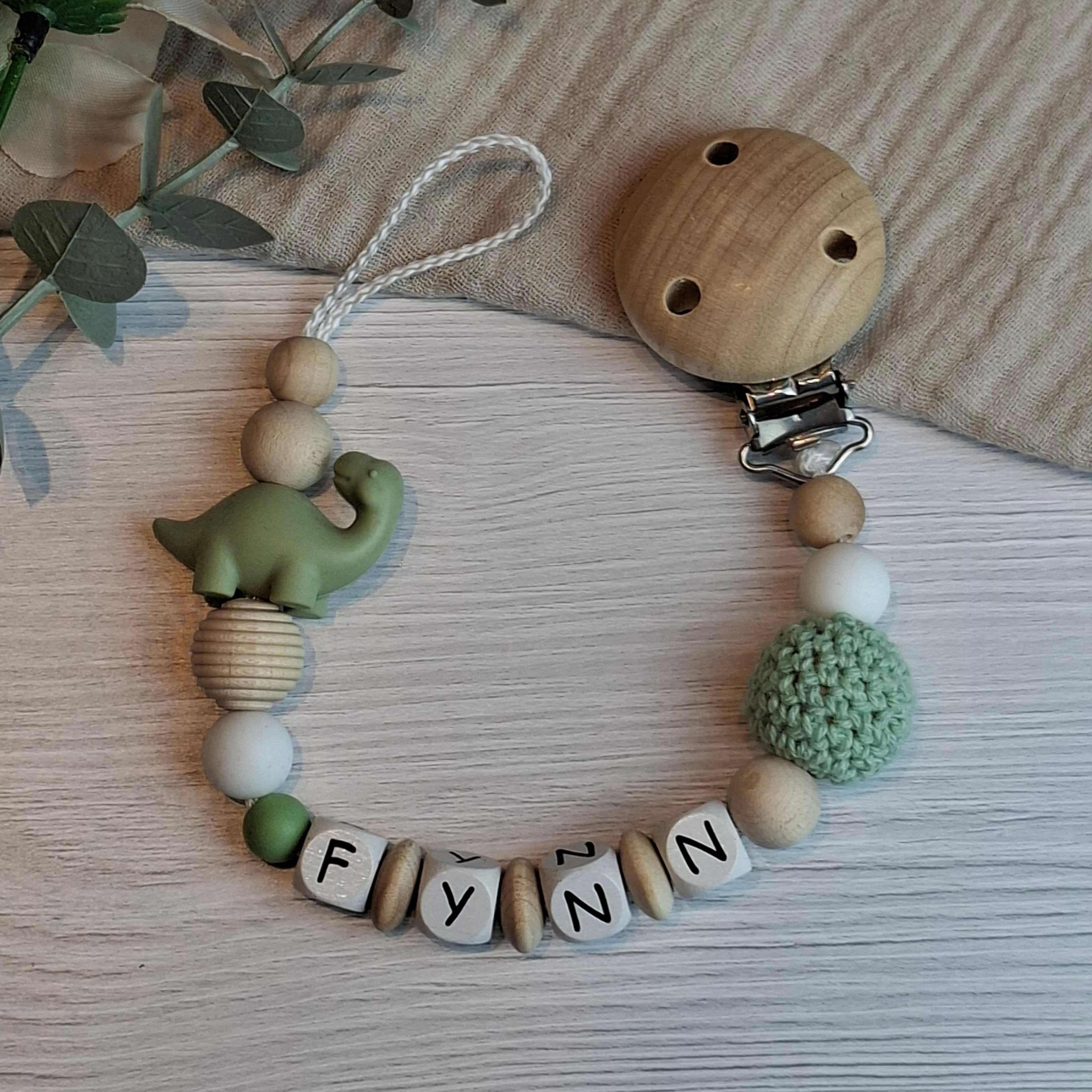 Schnullerkette Dino olive